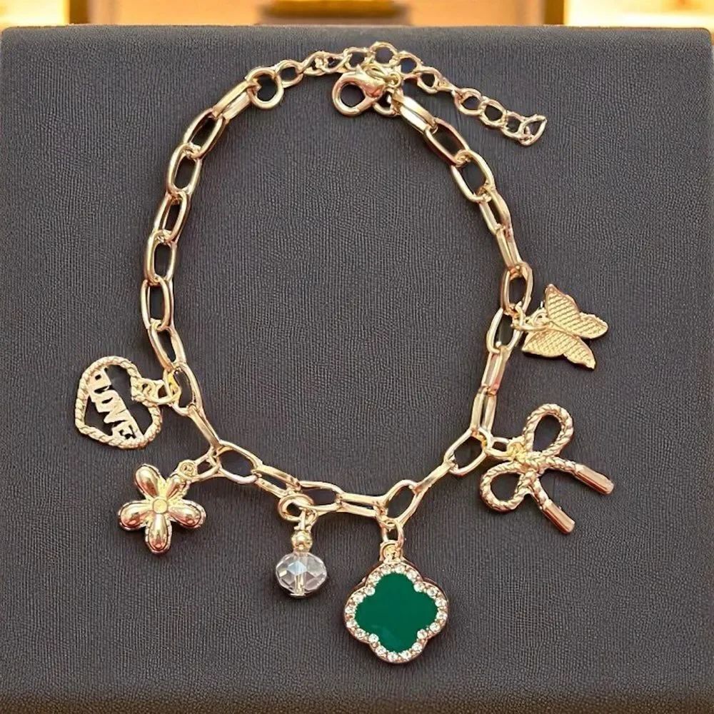 Gold Tone Charm Bracelet with Green Clover Heart Bow Butterfly And Flower Charm